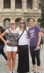 A group of 'Cats of pose in front of the Colosseum Saturday.