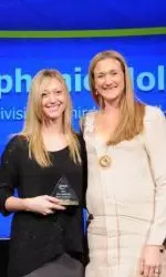 Stephanie Holthus (left) received her AVCA All-American award from U.S. Olympian Kerri Walsh Jennings in December.