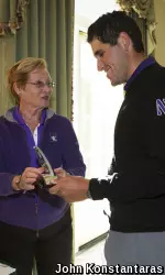 Bennett Lavin receives his tournament trophy from Holly Windon-Starck.