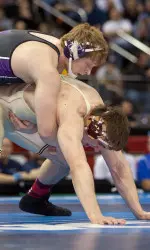 Mike McMullan recorded a 3-1 overtime victory against defending NCAA champion Tony Nelson of Minnesota Friday night.