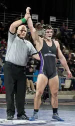No. 17 Alex Polizzi earned No. 14 NU six team points with a fall over the Badgers Timmy McCall Sunday.
