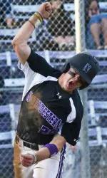 RJ Watters celebrates after scoring the game-tying run in the bottom of the ninth against Iowa on April 11.