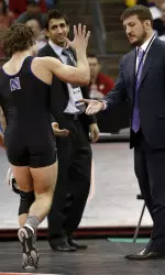 Jason Tsirtsis high fives head coach Drew Pariano during his run to the 149 lbs. NCAA Title.