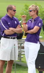 Women's golf coach Emily Fletcher chats with Jim Phillips prior to the 2014 NCAA Championships.