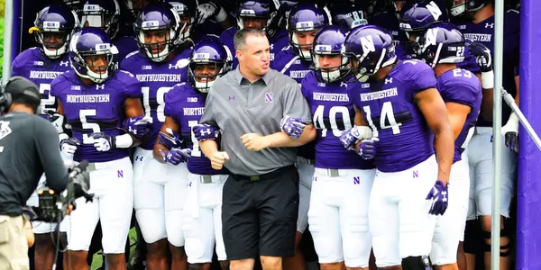 Pat Fitzgerald team entrance arm in arm