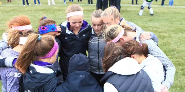 Cross country team huddle