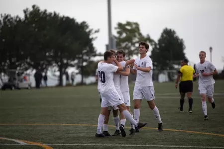 Mens soccer celebration