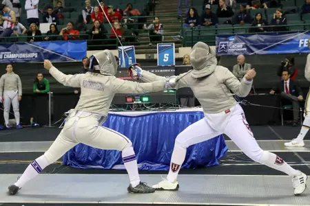 CLEVELAND, OH - MARCH 24: Emine Yucel of Northwestern competes against Veronica Czyzewski of Harvard at the National Collegiate Fencing Championships on March 24, 2019, at the Wolstein Center in Cleveland, OH. (Photo by Frank Jansky)