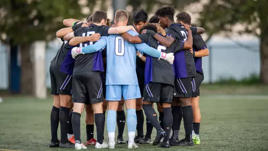 Men's Soccer huddle vs Loyola