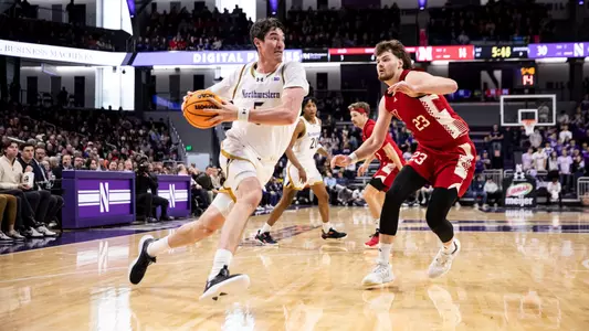 Northwestern's Keenan Fitzmorris drives to the baseline against Nebraska.