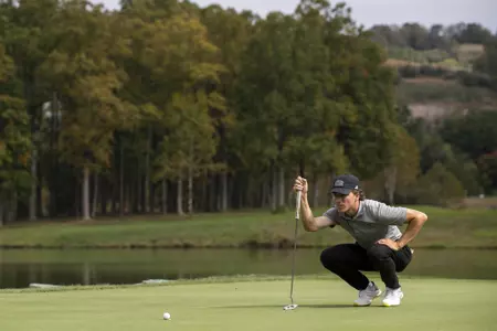 Hogan lines up a putt