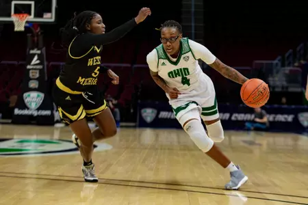 Erica Johnson dribbles past the defender