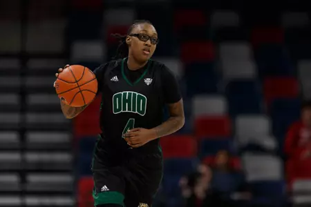 Erica Johnson dribbles up court