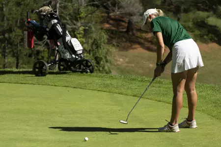 women's golf putt