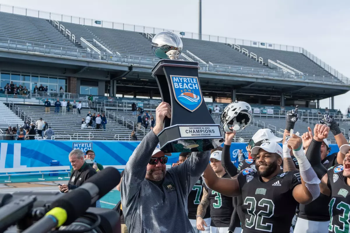 Tim Albin with 2023 Myrtle Beach Bowl trophy