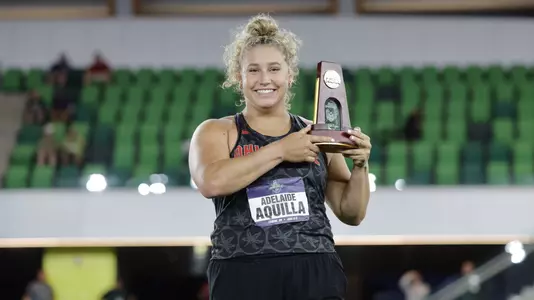 Aquilla Breaks Collegiate Shot Put Record, Defends National Title