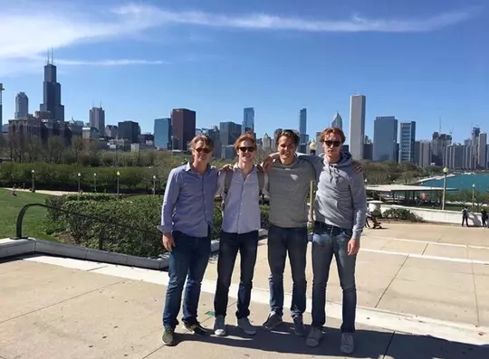 men posing for picture in the city
