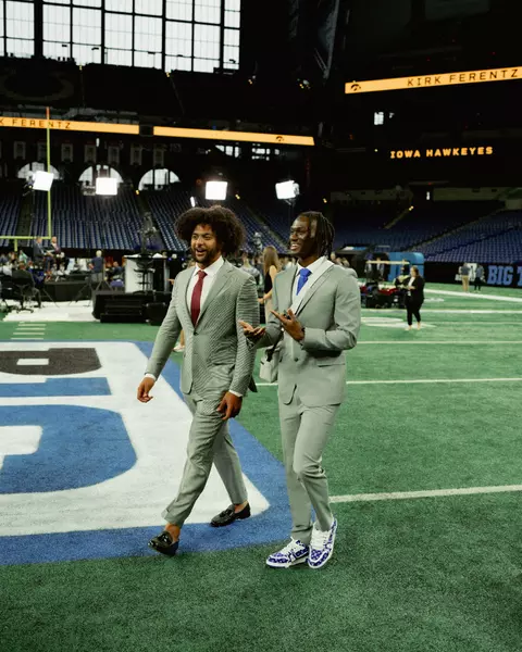 JT and Marvin Harrison walking