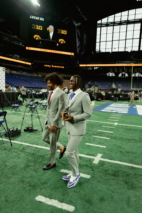 JT and Marvin Harrison walking