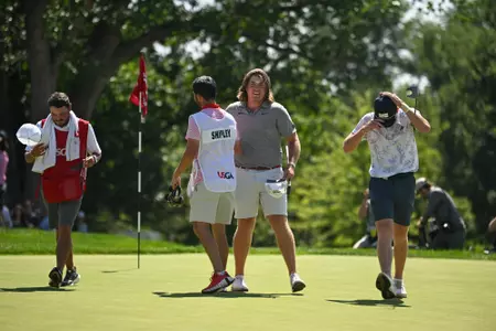 Neal Shipley shakes hands with his caddie Carter Pitcairn after finishing 18 holes during the final match of the 2023 U.S. Amateur at Cherry Hills C.C. in Cherry Hills Village, Colo. on Sunday, Aug. 20, 2023. (Kathryn Riley/USGA)