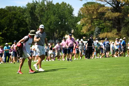 Neal Shipley and his caddie Carter Pitcairn walks up the hole 27 fairway together during the final match of the 2023 U.S. Amateur at Cherry Hills C.C. in Cherry Hills Village, Colo. on Sunday, Aug. 20, 2023. (Kathryn Riley/USGA)