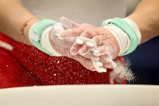 UNIVERSITY PARK, PA - APRIL 14: A general view as a gymnast applies chalk to their hands during the Division I Men?s Gymnastics Championship held at Rec Hall on April 14, 2023 in University Park, Pennsylvania. (Photo by Scott Taetsch/NCAA Photos via Getty Images)