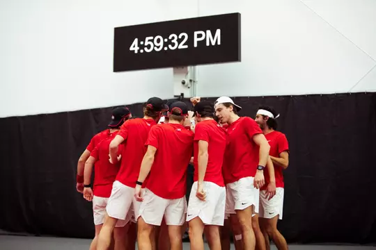 Men's tennis team huddle