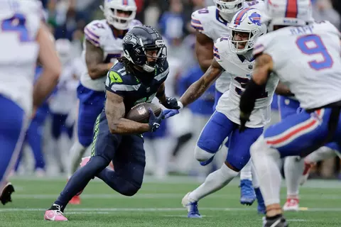 Seattle Seahawks wide receiver Jaxon Smith-Njigba (11) runs the ball during the first half of an NFL football game against the Buffalo Bills, Sunday, Oct. 27, 2024, in Seattle. (AP Photo/John Froschauer)