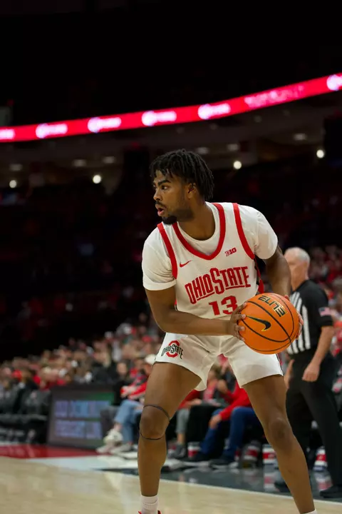 Mens basketball player 13 with ball