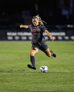 Jacinda Bonham crossing the ball, Ohio State Women's Soccer