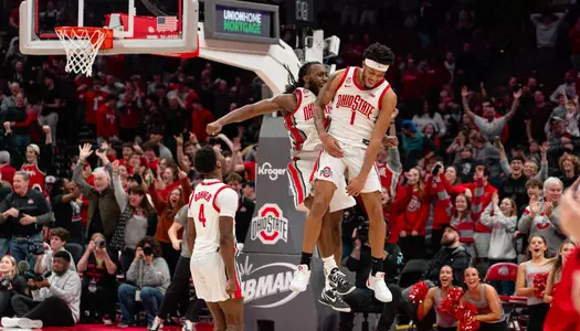 Bruce Thornton and Roddy Gayle Jr. celebrate the win over Maryland 79-75