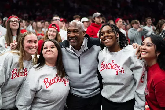 Gene Smith smiling with fans