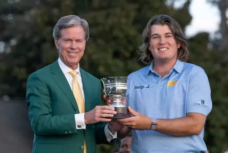 Amateur Neal Shipley of the United States is presented with the Low Amateur Silver Cup by Chairman of Augusta National Golf Club and the Masters Tournament Fred S. Ridley during the Green Jacket Presentation Ceremony alongside his family after the final round of the 2024 Masters Tournament at Augusta National Golf Club, Sunday, April 14, 2024.