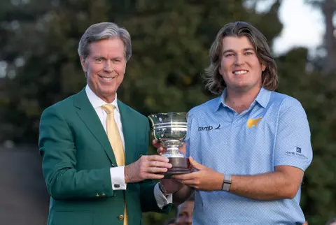 Amateur Neal Shipley of the United States is presented with the Low Amateur Silver Cup by Chairman of Augusta National Golf Club and the Masters Tournament Fred S. Ridley during the Green Jacket Presentation Ceremony alongside his family after the final round of the 2024 Masters Tournament at Augusta National Golf Club, Sunday, April 14, 2024.