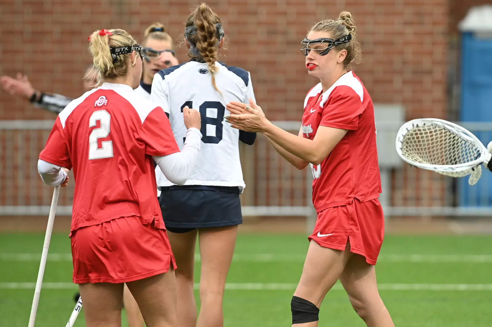 Ohio State's Zoe Coleman (45) celebrates her goal with Emily Magalotti (2) against Penn State during the 2024 Big Ten Women's Lacrosse Tournament quarterfinal game on April 27, 2024 in University Park, Pa. No. 7 seed Ohio State fell to No. 2 seed Penn State 13-15. Photo/Craig Houtz