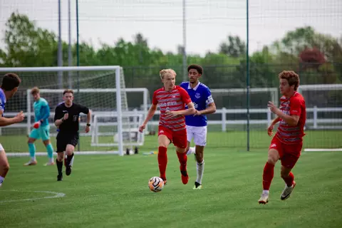 OSU Soccer Game in England vs Everton, Thomas Gilej looks up to pass while dribbling the ball