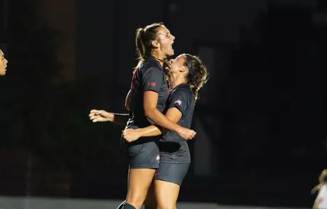 Kailyn Dudukovich and Amanda Schlueter celebrate a goal