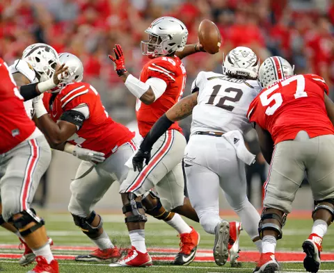 Ohio State Buckeyes quarterback J.T. Barrett (16) throws an interception against Western Michigan Broncos defense in the 4th quarter of their game at Ohio Stadium on September 26, 2015.  (Dispatch photo by Kyle Robertson)