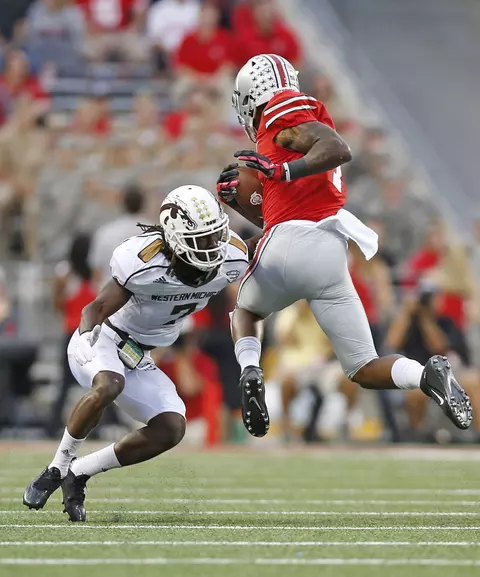 Ohio State Buckeyes wide receiver Braxton Miller (1) leaps to try to get past Western Michigan Broncos cornerback Ronald Zamort (7) in the fourth quarter of the college football game between the Ohio State Buckeyes and the Western Michigan Broncos at Ohio Stadium in Columbus, Saturday afternoon, September 26, 2015. The Ohio State Buckeyes defeated the Western Michigan Broncos 38 - 12. (The Columbus Dispatch / Eamon Queeney)