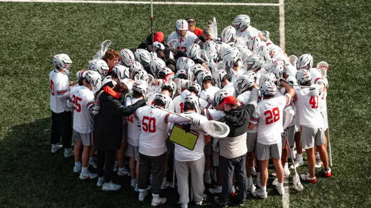MLAX team huddle