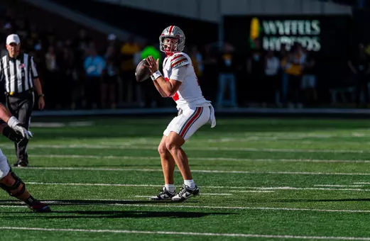 Julian Sayin throwing a pass against Iowa