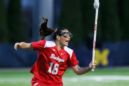 Midfielder Audrey Rudolph celebrates an Ohio State teammates goal against Michigan during the second half of a women's lacrosse match Thursday, April 2, 2026, in Ann Arbor, Mich. (Photo by Duane Burleson for Ohio State University)