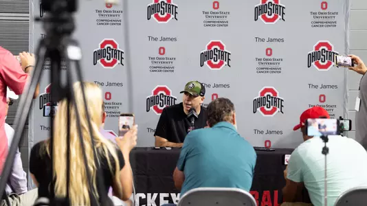 Football Players and Coaches Talk With Media After Practice