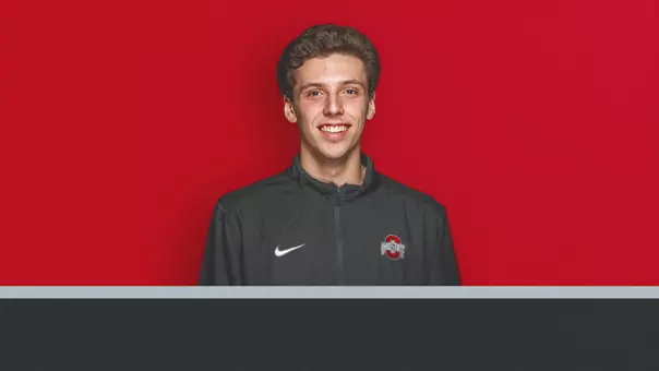 Head shot graphic of Andrew Lutschaunig announcing his hiring as the new assistant coach for men's tennis.