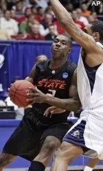 Cowboy Obi Muonelo powers past Pittsburgh's Tyrell Biggs in the second round of the NCAA Tournament.