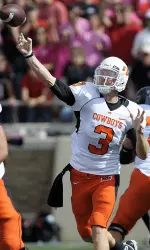 Oklahoma State quarterback Brandon Weeden throws against Texas Tech during the first half