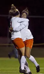 The Cowgirls celebrate their first goal in Friday's win over Michigan.