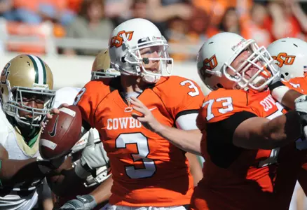 Oklahoma State quarterback Brandon Weeden throws downfield against Baylor.