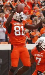 Justin Blackmon had 173 yards receiving and a touchdown and also scored on a 69-yard run in his return to the Cowboys.