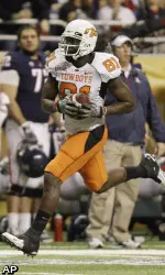 Oklahoma State's Justin Blackmon runs for a touchdown after making a catch.